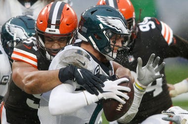 Nov 22, 2020; Cleveland, Ohio, USA; Cleveland Browns defensive end Olivier Vernon (54) sacks Philadelphia Eagles quarterback Carson Wentz (11) for a safety during the second half at FirstEnergy Stadium. Mandatory Credit: Scott Galvin-USA TODAY Sports