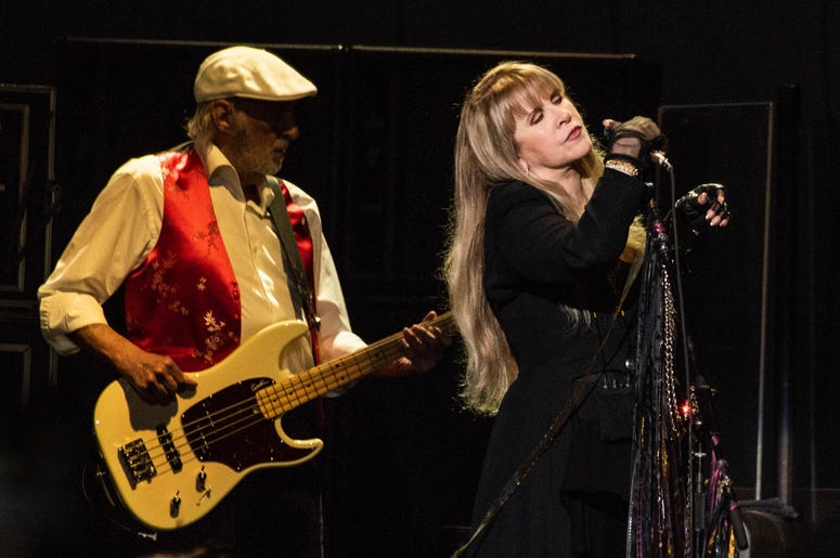 Stevie Nicks and John McVie of Fleetwood Mac perform onstage at The SAP Center on November 21, 2018 in San Jose, California. Stevie Nicks and John McVie of Fleetwood Mac perform onstage at The SAP Center on November 21, 2018 in San Jose, California.