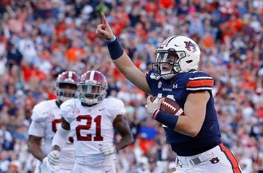 Bo Nix #10 of the Auburn Tigers reacts as he rushes for a touchdown against the Alabama Crimson Tide