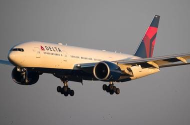 A Delta Air Lines Boeing 777 lands at Seattle-Tacoma International Airport in September 2018. 636745750994889901-USAT-Oct-18-4.jpg