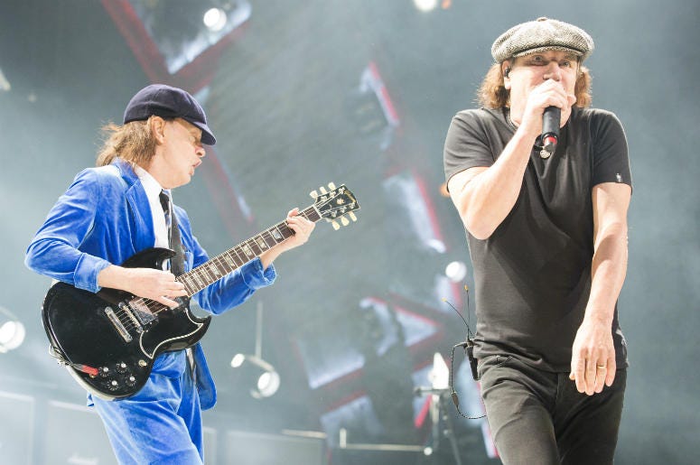 Angus Young (L) and Brian Johnson of AC/DC perform in 2016 Angus Young (L) and Brian Johnson of AC/DC perform in 2016