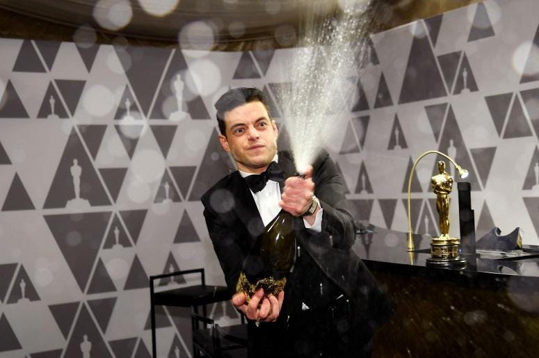 Rami Malek sprays champagne during the 91st Annual Academy Awards Governors Ball