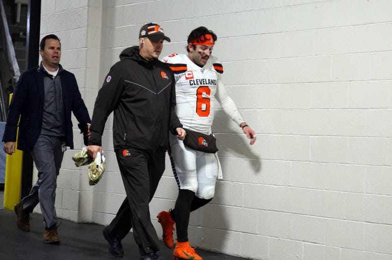 PITTSBURGH, PA - DECEMBER 01: Baker Mayfield #6 of the Cleveland Browns leaves the field with medical staff after leaving the game with a hand injury against the Pittsburgh Steelers on December 1, 2019 at Heinz Field in Pittsburgh, Pennsylvania. (Photo by PITTSBURGH, PA - DECEMBER 01: Baker Mayfield #6 of the Cleveland Browns leaves the field with medical staff after leaving the game with a hand injury against the Pittsburgh Steelers on December 1, 2019 at Heinz Field in Pittsburgh, Pennsylvania. (Photo by