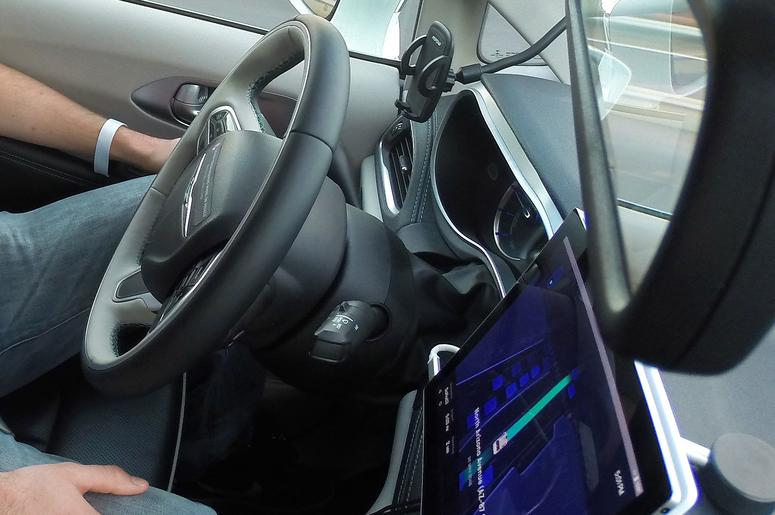 Waymo safety driver Derek Sirakis monitors a self-driving car during a demonstration ride in Chandler. Tempe, Mesa, Chandler and Gilbert will be the first cities in the world with Waymo One self-driving service. Waymo One