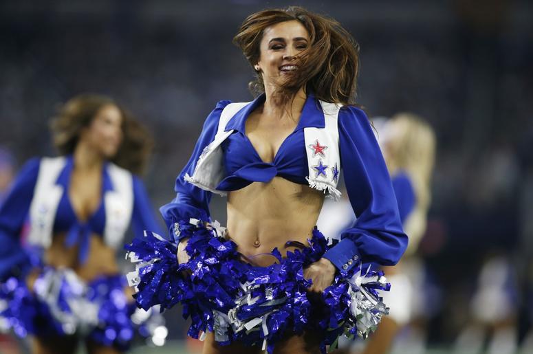 Dallas Cowboys cheerleader performs during a time out in the game against the Buffalo Bills at AT&T Stadium. Dallas Cowboys cheerleader performs during a time out in the game against the Buffalo Bills at AT&T Stadium.