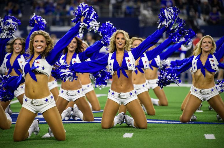 he Dallas Cowboys cheerleaders perform during the game between the Cowboys and the Buffalo Bills at AT&T Stadium. he Dallas Cowboys cheerleaders perform during the game between the Cowboys and the Buffalo Bills at AT&T Stadium.