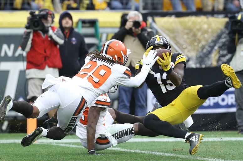 Pittsburgh Steelers wide receiver James Washington (13) catches a touchdown pass against Cleveland Browns defensive back T.J. Carrie (rear) and defensive back Sheldrick Redwine (29) during the second quarter at Heinz Field. Pittsburgh Steelers wide receiver James Washington (13) catches a touchdown pass against Cleveland Browns defensive back T.J. Carrie (rear) and defensive back Sheldrick Redwine (29) during the second quarter at Heinz Field.