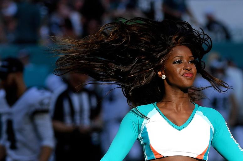 Miami Dolphins cheerleader performs during the second half against the Philadelphia Eagles at Hard Rock Stadium. Miami Dolphins cheerleader performs during the second half against the Philadelphia Eagles at Hard Rock Stadium.