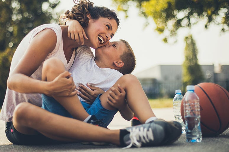 Mother and son on basketball court