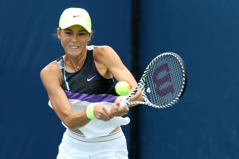 Natalia Vikhlyantseva of Russia returns a shot against Julia Goerges of Germany