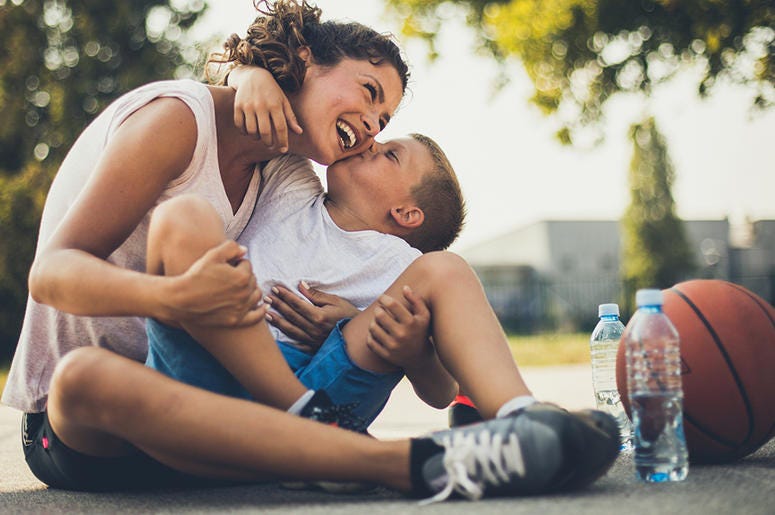 Mother and son on basketball court