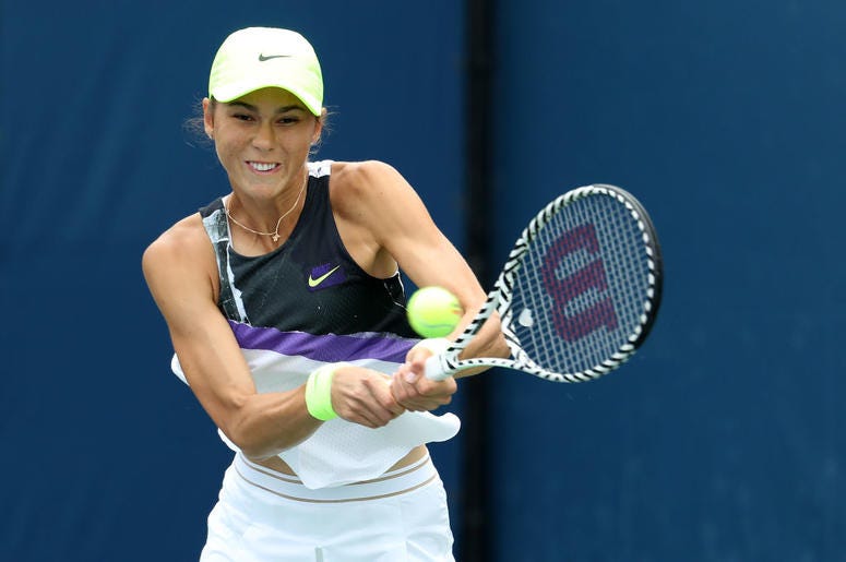 Natalia Vikhlyantseva of Russia returns a shot against Julia Goerges of Germany