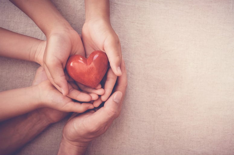 hands holding a heart hands holding a heart