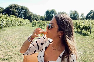sabrina drinking wine in vineyard Sabrina drinking wine in vineyard