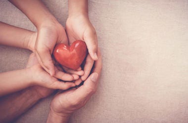 hands holding a heart hands holding a heart