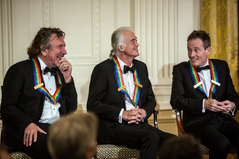 Robert Plant, Jimmy Page, and John Paul Jones (L-R) of the band Led Zeppelin attend the Kennedy Center Honors reception at the White House on December 2, 2012 Robert Plant, Jimmy Page, and John Paul Jones (L-R) of the band Led Zeppelin attend the Kennedy Center Honors reception at the White House on December 2, 2012