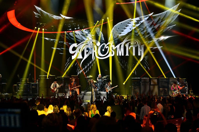 Aerosmith NEW YORK, NY - AUGUST 20: Aerosmith and Post Malone (R) perform onstage during the 2018 MTV Video Music Awards at Radio City Music Hall on August 20, 2018 in New York City.