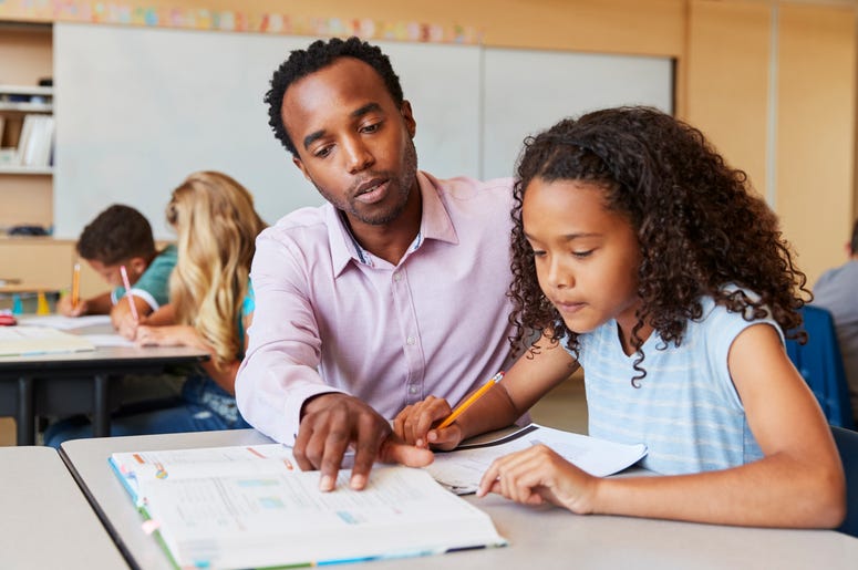 Teacher Helping Student