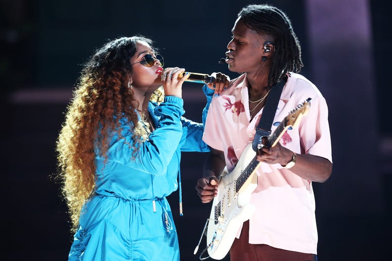 H.E.R. and Daniel Caesar perform onstage at the 2018 BET Awards H.E.R. and Daniel Caesar perform onstage at the 2018 BET Awards (Photo by Frederick M. Brown/Getty Images for BET)