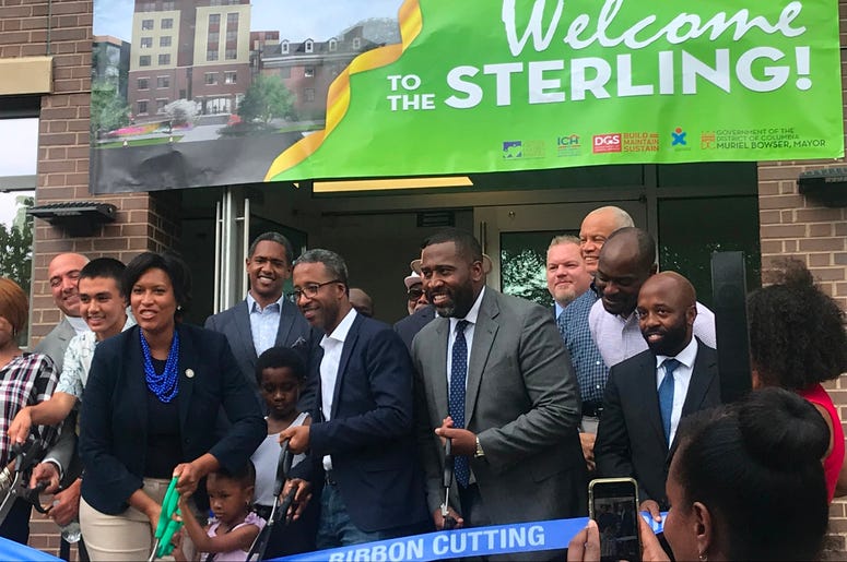 Mayor Muriel Bowser cut the ribbon on a brand new short-term family living facility. Mayor Muriel Bowser cut the ribbon on a brand new short-term family living facility.