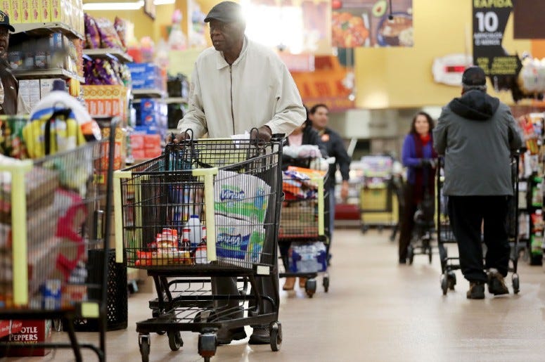 Seniors shop for groceries during special hours open to seniors and the disabled. Seniors shop for groceries during special hours open to seniors and the disabled.