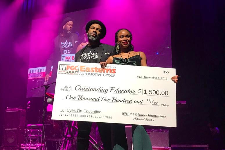 Andrea Hoes was awarded with $1500 for being an outstanding educator. Andrea Hoes was awarded with $1500 for being an outstanding educator.