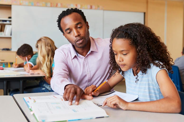 Teacher Helping Student