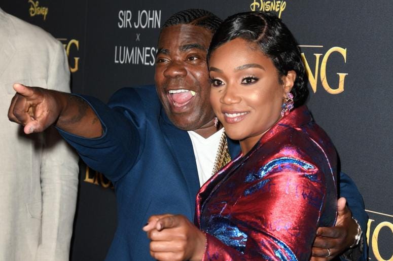 Tracy Morgan and Tiffany Haddish coordinate in suits. Tracy Morgan and Tiffany Haddish coordinate in suits.