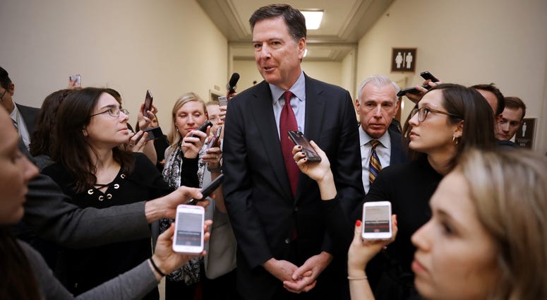 Former Federal Bureau of Investigation Director James Comey is surrounded by reporters after testifying to the House Judiciary and Oversight and Government Reform committees at the Rayburn House Office Building on Capitol Hill December 07, 2018 in Washing