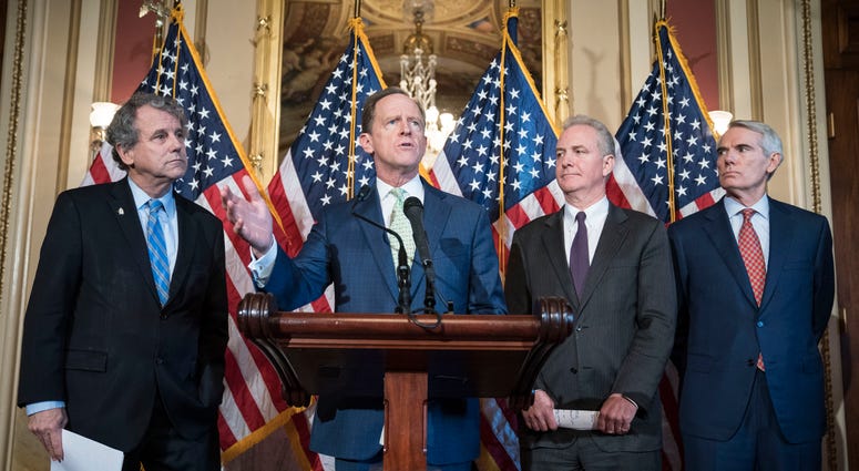 WASHINGTON, DC - DECEMBER 18: Sen. Pat Toomey (R-PA) speaks at a press conference on S.667, the "Otto Warmbier North Korea Nuclear Sanctions and Enforcement Act," with a bipartisan group of Senators and Cindy and Fred Warmbier