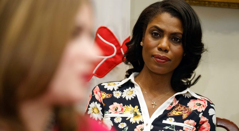 FILE - In this Feb. 14, 2017, file photo, Omarosa Manigault-Newman, then an aide to President Donald Trump, watches during a meeting with parents and teachers in the Roosevelt Room of the White House in Washington. The White House is slamming a new book b