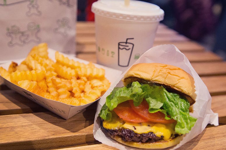 CHICAGO, IL - JANUARY 28: In this photo illustration a cheeseburger and french fries are served up at a Shake Shack restaurant on January 28, 2015 in Chicago, Illinois. The burger chain, with currently has 63 locations, is expected to go public this week CHICAGO, IL - JANUARY 28: In this photo illustration a cheeseburger and french fries are served up at a Shake Shack restaurant on January 28, 2015 in Chicago, Illinois. The burger chain, with currently has 63 locations, is expected to go public this week