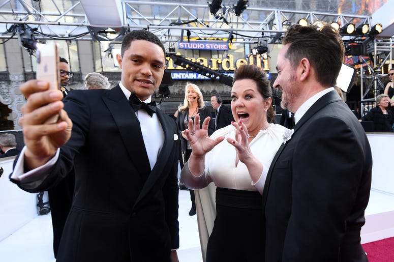 February 24, 2019; Los Angeles, CA, USA; (L-R) Trevor Noah, Melissa McCarthy and husband Ben Falcone take a selfie at the 91st Academy Awards at the Dolby Theatre. Mandatory Credit: Robert Hanashiro-USA TODAY NETWORK February 24, 2019; Los Angeles, CA, USA; (L-R) Trevor Noah, Melissa McCarthy and husband Ben Falcone take a selfie at the 91st Academy Awards at the Dolby Theatre. Mandatory Credit: Robert Hanashiro-USA TODAY NETWORK