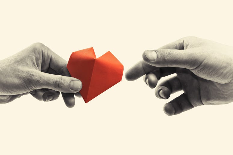 Charity Hand Giving Heart hands exchanging paper heart