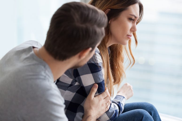 Man Comforts Woman