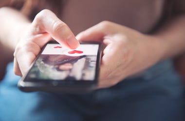 Guy Holding Dating App