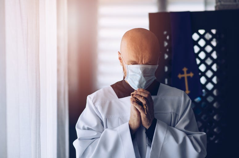Priest with mask