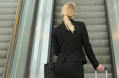 Woman On Escalator