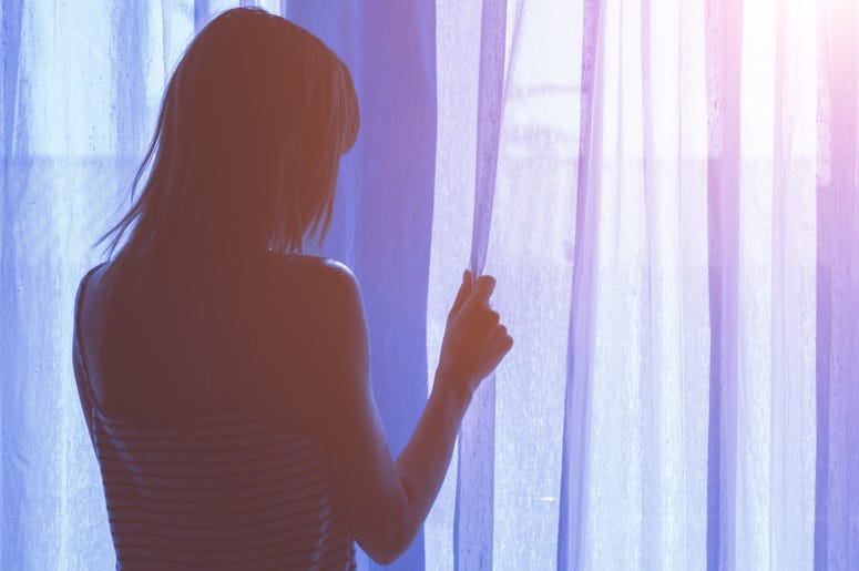 Woman By Window