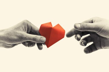 Charity Hand Giving Heart hands exchanging paper heart