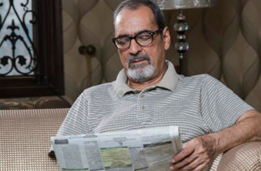 Man reading newspaper