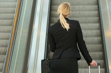 Woman On Escalator