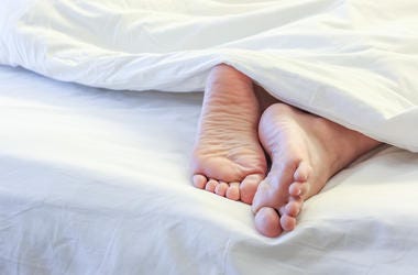 Feet In Bed