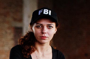 Woman Wearing FBI Hat