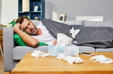 Man Sick With Flu man sick on couch