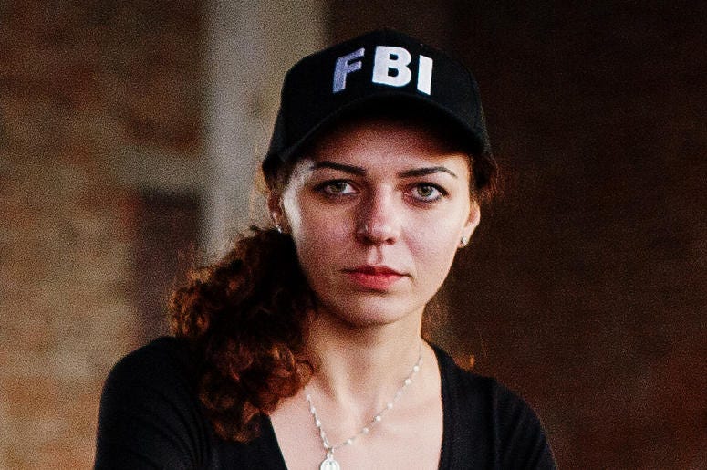 Woman Wearing FBI Hat