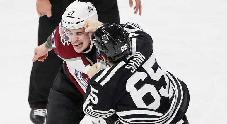 Blackhawks center Andrew Shaw (65) fights with Colorado Avalanche defenseman Ryan Graves (27). Blackhawks center Andrew Shaw (65) fights with Colorado Avalanche defenseman Ryan Graves (27).