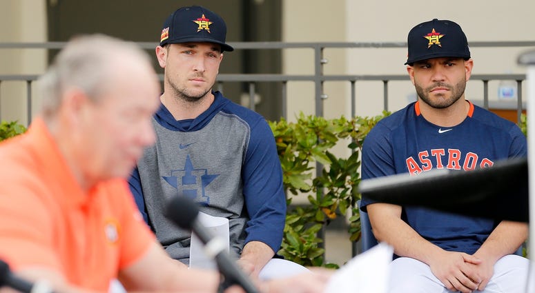 Astros third basman Alex Bregman, left, and second baseman Jose Altuve look on as owner Jim Crane, foreground, speaks at a press conference addressing the team's cheating scandal. Astros third basman Alex Bregman, left, and second baseman Jose Altuve look on as owner Jim Crane, foreground, speaks at a press conference addressing the team's cheating scandal.