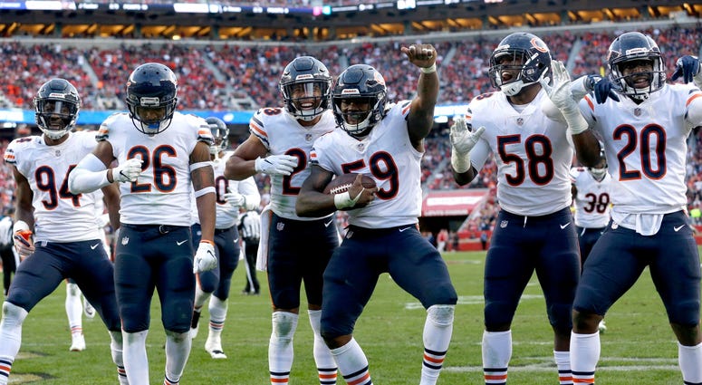 Bears linebacker Danny Trevathan (59) celebrates with teammates after recording an interception. Bears linebacker Danny Trevathan (59) celebrates with teammates after recording an interception.