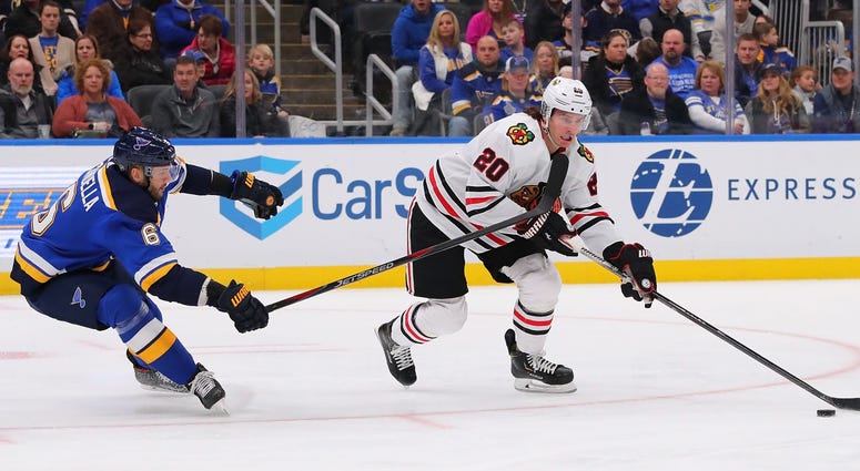 Blackhawks forward Brandon Saad (20) draws a penalty against the Blues. Blackhawks forward Brandon Saad (20) draws a penalty against the Blues.